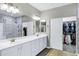 Spacious bathroom features double sinks, tiled shower, and a walk-in closet at 4647 E County Down Dr, Chandler, AZ 85249