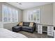 Comfortable bedroom features window with shutters, desk and daybed with yellow accent pillows at 4647 E County Down Dr, Chandler, AZ 85249