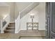 Elegant entryway with a staircase and decorative console table with lamp at 4647 E County Down Dr, Chandler, AZ 85249
