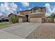 Charming two-story home features a spacious driveway and well-maintained landscaping at 4647 E County Down Dr, Chandler, AZ 85249