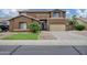 Stunning two-story home with a two-car garage and desert landscaping at 4647 E County Down Dr, Chandler, AZ 85249