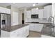 Modern kitchen with stainless steel appliances and sleek granite countertops at 4647 E County Down Dr, Chandler, AZ 85249