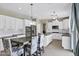Bright, white kitchen featuring stainless steel appliances and granite countertops at 4647 E County Down Dr, Chandler, AZ 85249