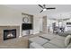 Cozy living room with fireplace and a view of the open-concept kitchen at 4647 E County Down Dr, Chandler, AZ 85249