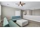 Spacious upper living area featuring neutral walls, ceiling fan, and comfortable seating options at 4647 E County Down Dr, Chandler, AZ 85249