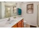 Bathroom features a sink, toilet, shower, windows and tile flooring at 5220 W Desert Ln, Laveen, AZ 85339