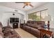 Cozy living room featuring tile floors, neutral walls, and comfortable furnishings at 5220 W Desert Ln, Laveen, AZ 85339