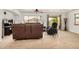 Open concept living room featuring tile floors, neutral walls, and a ceiling fan at 5220 W Desert Ln, Laveen, AZ 85339