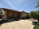 Relaxing back patio with a tiled surface, covered area, and easy access to lush backyard landscaping at 5420 S Mariposa Dr, Gilbert, AZ 85298