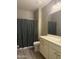 Bathroom featuring tiled floors, a shower with curtains, a toilet, and a vanity with storage at 5420 S Mariposa Dr, Gilbert, AZ 85298