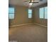 Spacious primary bedroom featuring carpet flooring and three windows for natural light at 5420 S Mariposa Dr, Gilbert, AZ 85298