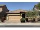 Charming single-story home featuring a two-car garage, manicured landscaping, and a beautiful tiled roof at 5420 S Mariposa Dr, Gilbert, AZ 85298