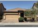 Charming single-story home featuring a two-car garage and manicured front yard at 5420 S Mariposa Dr, Gilbert, AZ 85298