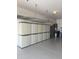 Spacious garage with epoxy floors, storage cabinets, and overhead storage racks at 5420 S Mariposa Dr, Gilbert, AZ 85298