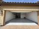 Spacious garage featuring an epoxy floor and storage cabinets at 5420 S Mariposa Dr, Gilbert, AZ 85298
