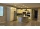 Open-concept kitchen featuring an island, modern appliances, and sleek design elements with tile flooring at 5420 S Mariposa Dr, Gilbert, AZ 85298