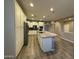 Beautiful kitchen with large island, stainless appliances, white cabinetry, and modern tile flooring at 5420 S Mariposa Dr, Gilbert, AZ 85298