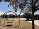 Inviting playground featuring a swing and basketball court, perfect for active outdoor recreation at 5420 S Mariposa Dr, Gilbert, AZ 85298