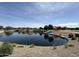 Scenic community pond with lush landscaping, walking paths, and playground enhances the outdoor experience at 5420 S Mariposa Dr, Gilbert, AZ 85298