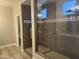 The luxurious tiled shower features mosaic tile and rain shower fixture at 5420 S Mariposa Dr, Gilbert, AZ 85298