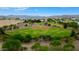 Aerial view of baseball field with green grass, red clay infield, and trees at 5451 W Folley St, Chandler, AZ 85226
