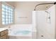 Bright bathroom featuring a tub and shower with tile flooring at 5451 W Folley St, Chandler, AZ 85226