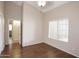 Large bedroom with window and hardwood floors at 5451 W Folley St, Chandler, AZ 85226