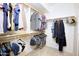 Spacious walk-in closet with ample storage and well-organized hanging rods for clothes and accessories at 5451 W Folley St, Chandler, AZ 85226