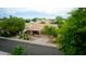 Attractive single story home featuring a desert landscape, tile roof, and covered front porch at 5451 W Folley St, Chandler, AZ 85226