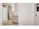 Neutral hallway featuring beige paint, tile floor, and baseboards at 5451 W Folley St, Chandler, AZ 85226