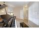 Living Room with ample light, high ceilings, tile floors, and an elegant piano at 5451 W Folley St, Chandler, AZ 85226