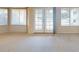 Bright living room featuring neutral tones, plush carpeting, and natural light through large windows at 5451 W Folley St, Chandler, AZ 85226