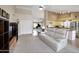 This open-concept living area features a piano, comfortable seating, and an adjacent kitchen, perfect for modern living at 5451 W Folley St, Chandler, AZ 85226