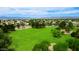 A sprawling green park with mature trees, offering open spaces for recreation and leisure activities at 5451 W Folley St, Chandler, AZ 85226