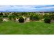 A sprawling green park with mature trees, offering open spaces for recreation and leisure activities at 5451 W Folley St, Chandler, AZ 85226