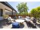 Covered back patio with comfortable seating and stylish outdoor decor at 546 W Cambridge Ave, Phoenix, AZ 85003