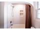 Clean and updated bathroom featuring a shower with white subway tile and niche at 546 W Cambridge Ave, Phoenix, AZ 85003