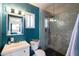 Modern bathroom with a tiled walk-in shower, vanity, and ample natural light at 546 W Cambridge Ave, Phoenix, AZ 85003
