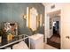 A stylish bathroom with bold wallpaper, modern vanity, and gold accents at 546 W Cambridge Ave, Phoenix, AZ 85003