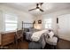 Inviting bedroom with an iron bed, decorative desk, and plush chair at 546 W Cambridge Ave, Phoenix, AZ 85003