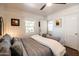 Bedroom with dark hardwood floors and a bed featuring decorative pillows and a white blanket at 546 W Cambridge Ave, Phoenix, AZ 85003