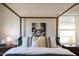 Close up of canopy bed in a bedroom with stylish pillows and an abstract painting at 546 W Cambridge Ave, Phoenix, AZ 85003