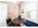 Cozy breakfast nook featuring an exposed brick wall and a window bench at 546 W Cambridge Ave, Phoenix, AZ 85003
