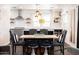 Stylish dining area with a wooden table, comfortable seating, and pendant lighting at 546 W Cambridge Ave, Phoenix, AZ 85003