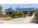 Beautiful home with a well manicured lawn and inviting paver walkway leading to the entrance at 546 W Cambridge Ave, Phoenix, AZ 85003