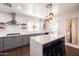 Modern kitchen features white countertops, gray cabinets, stainless steel appliances, and stylish pendant lights at 546 W Cambridge Ave, Phoenix, AZ 85003