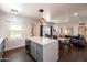 Open-concept kitchen and living area with modern appliances, pendant lights, and ample counter space at 546 W Cambridge Ave, Phoenix, AZ 85003