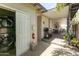 Covered outdoor laundry room with modern washer/dryer setup and access to the patio at 546 W Cambridge Ave, Phoenix, AZ 85003