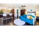 Studio living space featuring a kitchenette, sofa, bed, and modern furnishings at 546 W Cambridge Ave, Phoenix, AZ 85003