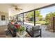 Covered patio with comfortable seating, ceiling fan, and view of the backyard at 546 W Cambridge Ave, Phoenix, AZ 85003